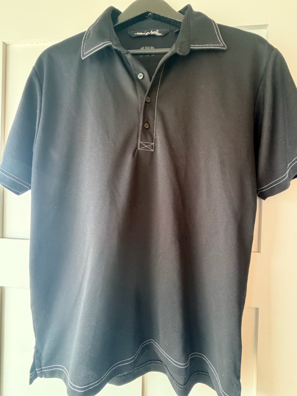 Travis Mathew Black Polo with White Contrast Stitching
